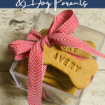 Personalized dog treats boxed with a red and white ribbon for gift giving from Good Bones Company