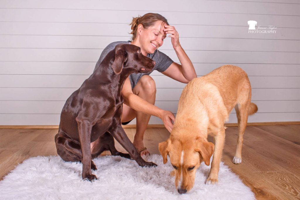 Blog author Ellen wrangles dogs Ruby and Olive for a photo shoot
